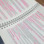 Photo of the ABPI Learning Manual with pink highlighter all over the text